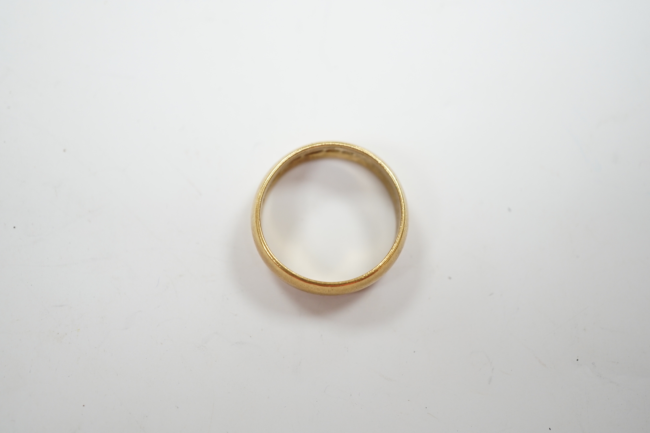 A 1960's 22ct gold wedding band, size M, 6 grams.